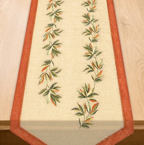 Bieżnik Salsa 40 × 140 cm pomarańczowo-zielone liście, białe tło – widok w aranżacji na stole