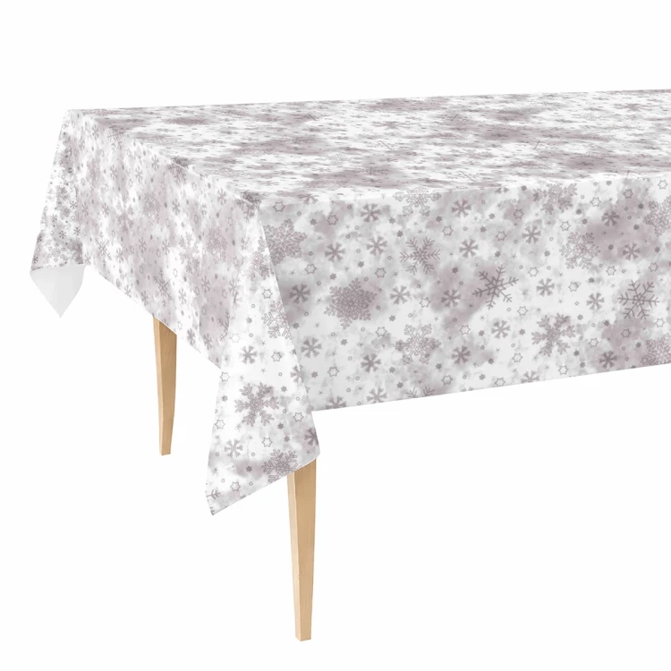 Obrus z ceraty FLO-1730-04 szaro-biały w śnieżynki na stole, białe tło
